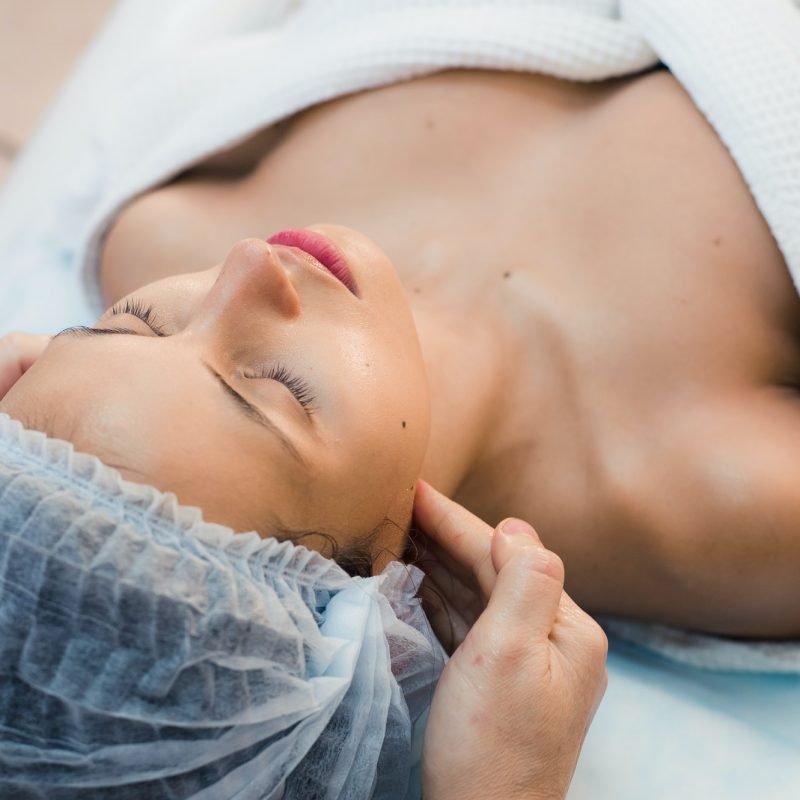 young-woman-enjoying-facial-at-spa-salon.jpg